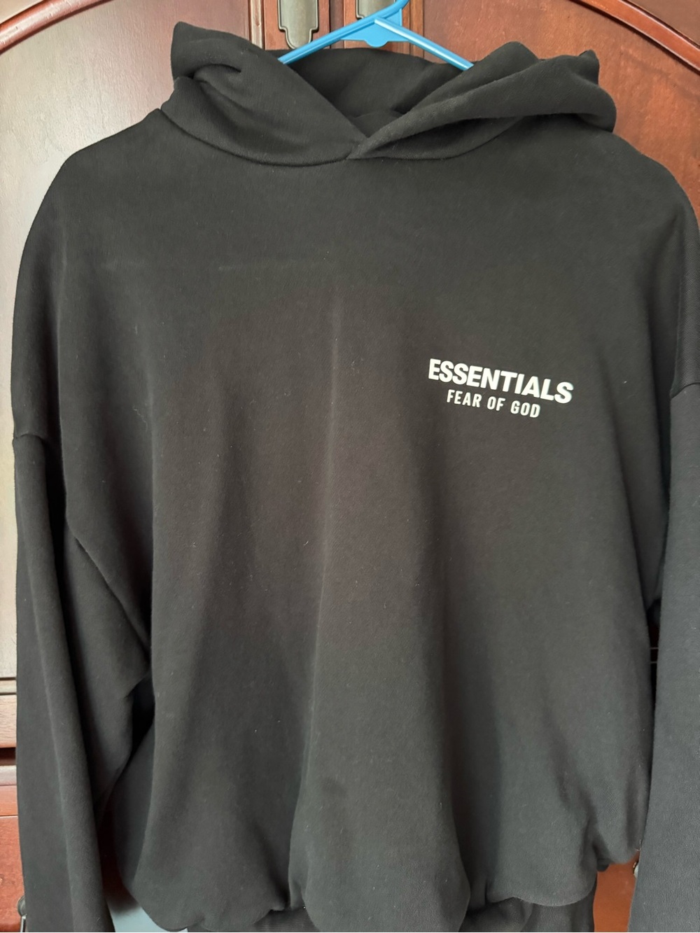 Fear of God ESSENTIALS Black Pullover Hoodie with Chest Logo